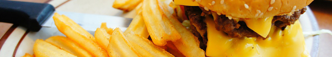 Eating American (Traditional) Burger Hot Dog at Matt's Famous Chili Dogs restaurant in Seattle, WA.